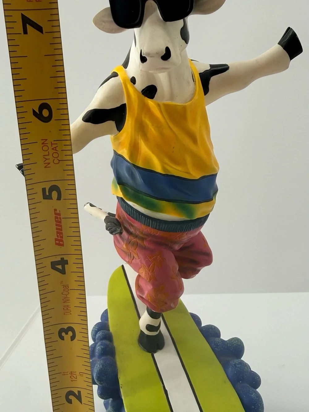 Playful Yellow Cow Figurine with Sunglasses Decorative Accent